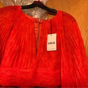 Crop top, zipper in back deep beep in front. Never been worn tags still on.